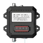 Black and gray electronic device with mounting brackets, a label featuring technical information, and visible ports and connectors on the front.