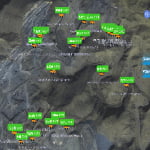 A satellite map view with green markers showing elevation and airplane icons, along with Chinese text labels, over a mountainous terrain.