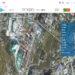 Aerial map view of an industrial area with a red path marked through several buildings and information displayed in Chinese on the right side.