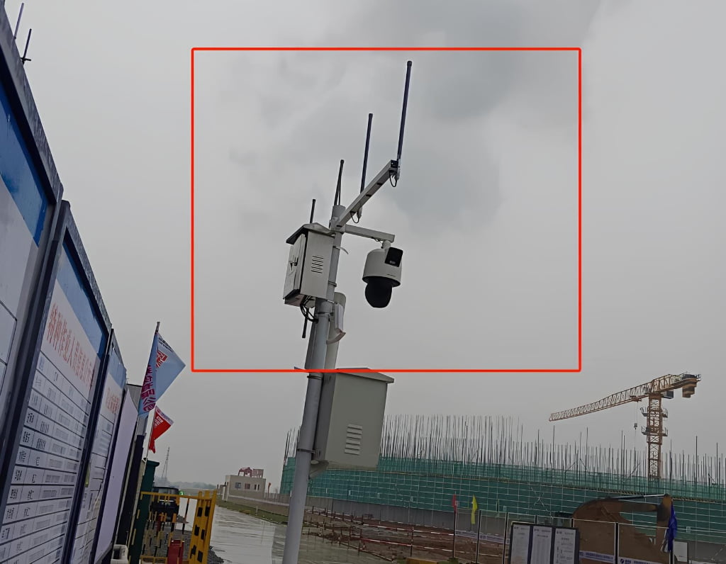 Outdoor installation of TXWG communication gateway with multiple antennas mounted on pole.