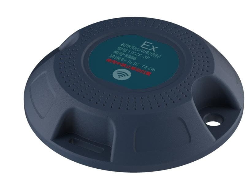 A dark gray, dome-shaped electronic device with a circular label featuring Chinese text and a Wi-Fi signal icon on the top surface.